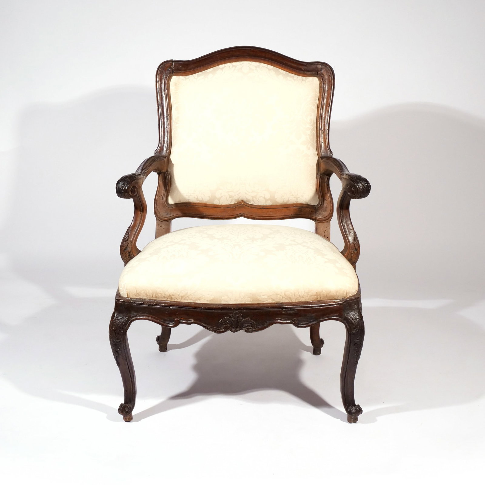 PERIOD LOUIS XV CARVED FAUTEUIL, CIRCA 1760: h. 37 w. 26 d. 26 in. Provenance: Descended through a prominent Upper East Side, NYC Estate [In Situ Item] This item will not be on display in our saleroom during our preview period. If you wish to vi