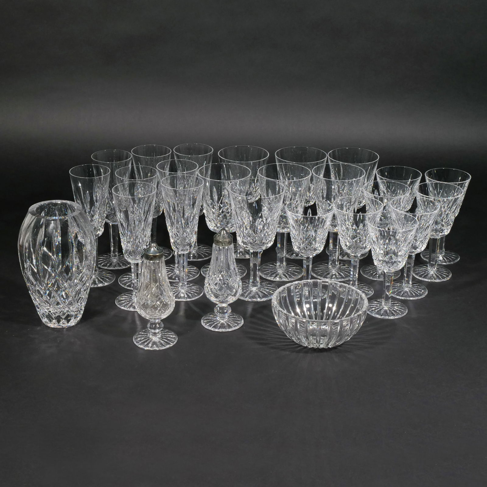 COLLECTION of WATERFORD CRYSTAL: Stemmed crystal glassware collection in Waterford's ?Lismore? pattern, including 8 flutes, 8 wine goblets, and 7 water goblets, with matching vase and pair of salt and pepper shakers, plus a "Marquis"