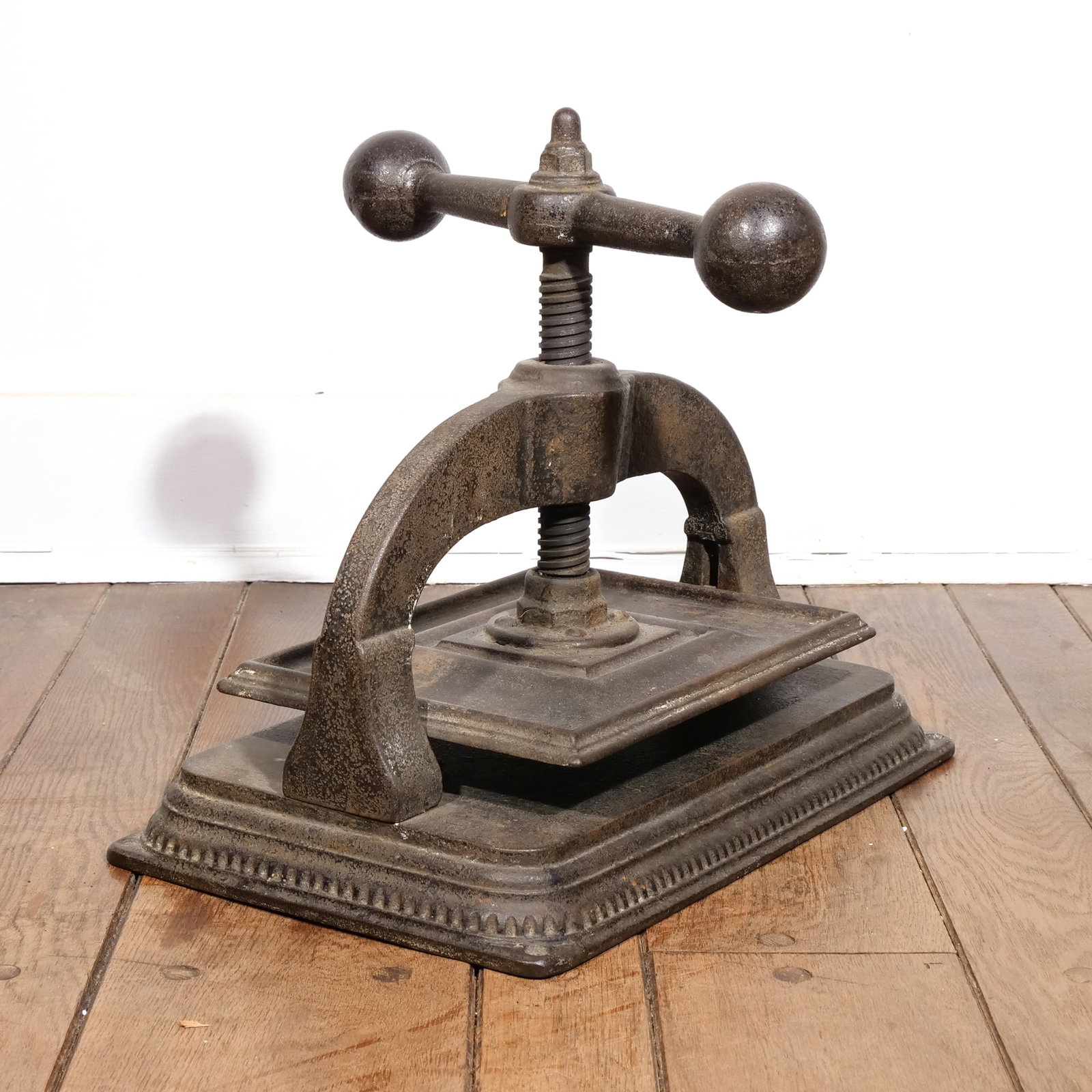 VINTAGE IRON BOOK PRESS: Handle with ball finials h. 15 in. w. 18 1/2 in. d. 11 1/2 in. Provenance: By descent through the family of an important South Salem, NY collector