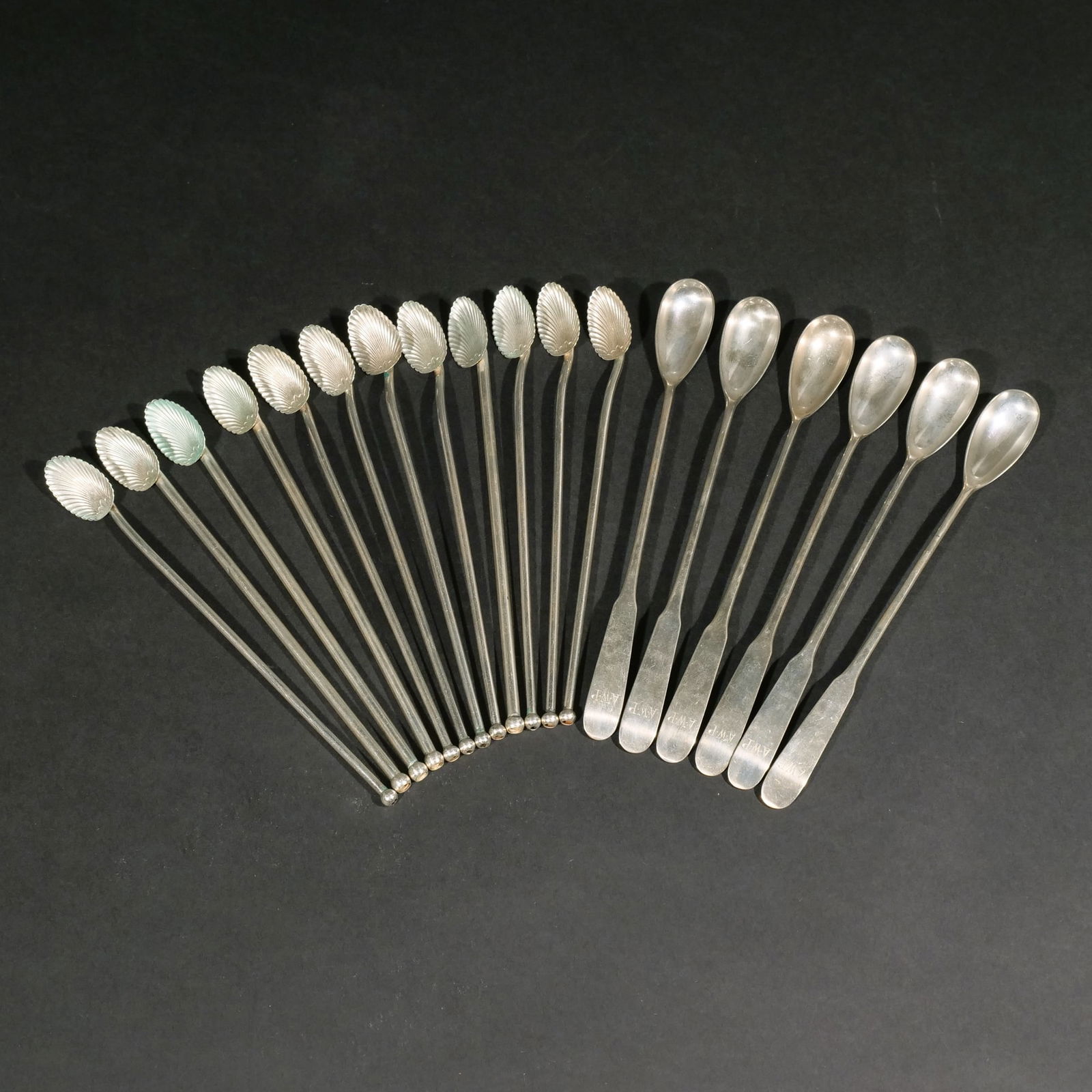 (18pc) STERLING SILVER SIPPING & COCKTAIL SPOONS: Including a set of 12 sipping spoons with shell-form bowls, "Sterling" fineness mark (l. 7-1/2 in.) [a few possibly bent]; and a set of 6 Old Newbury Crafters 8-inch cocktail spoons [with monogram AWP