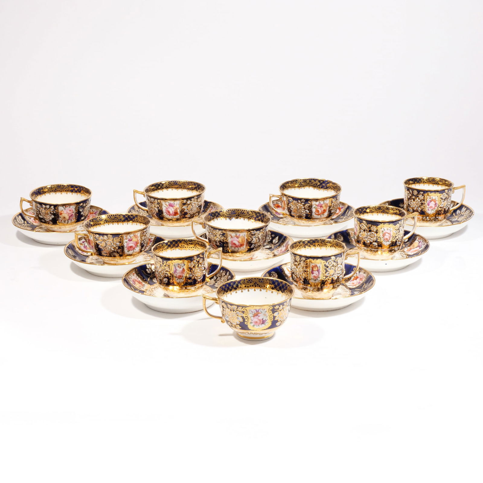 (19pc) COBALT BLUE & FLORAL TEA CUPS & SAUCERS: 19th century, including 10 cups and 9 saucers of varying sizes and designs, unmarked but probably English (Derby) h. 2-1/4 w. 4-1/4 in. (larger cups)Provenance: Descended through a Greenwich, CT famil