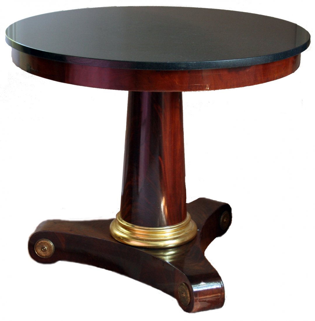 213) FRENCH EMPIRE MAHOGANY GUERIDON W/ BLACK GRANITE: FRENCH EMPIRE MAHOGANY GUERIDON W/ BLACK GRANITE TOP ON COLUMN FORM TRIPOD BASE W/ BRASS ROSETTES, FRENCH DIRECTOIRE PERIOD, D: 32.5" H: 27.5"; W/ SOME VENEER REPAIRS AROUND FRIEZE