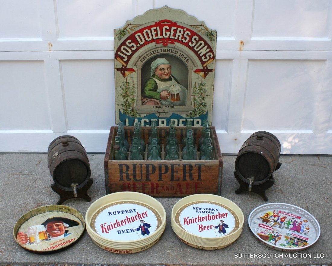 612) LOT OF BREWERY MEMORABILIA: 612) LOT OF BREWERY MEMORABILIA, including 2 small scale 9" kegs, a wooden Ruppert's beer bottle box with 17 "Ballantine's" and 7 "Ruppert's" bottles, a metal "Jos. Doelger's Sons" sign (24", reduced)