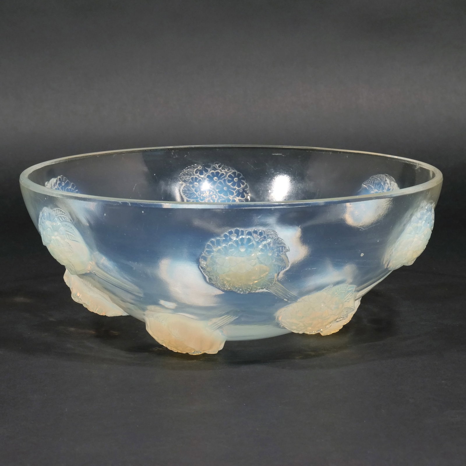 RENE LALIQUE 'TOURNON' BOWL: Model No. 401 introduced in 1928, clear and partially opalescent glass with molded flower decoration, molded signature R. LALIQUE / FRANCE h. 4-3/4 w. 12 in. Provenance: Descended through a Scarsdale,