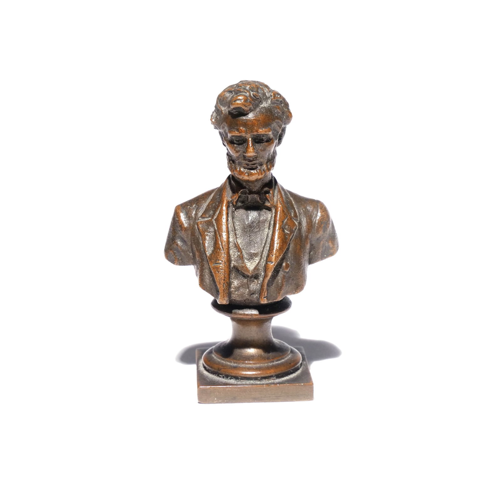 GEORGE EDWIN BISSELL (American, 1839-1920): Abraham Lincoln Bronze h. 2-1/2 w. 1-3/8 in. Bust of President Lincoln, of small size, marked on base "Geo. E. Bisell Sc" and dated 1898 Provenance: Descent through a Harrison, NY family