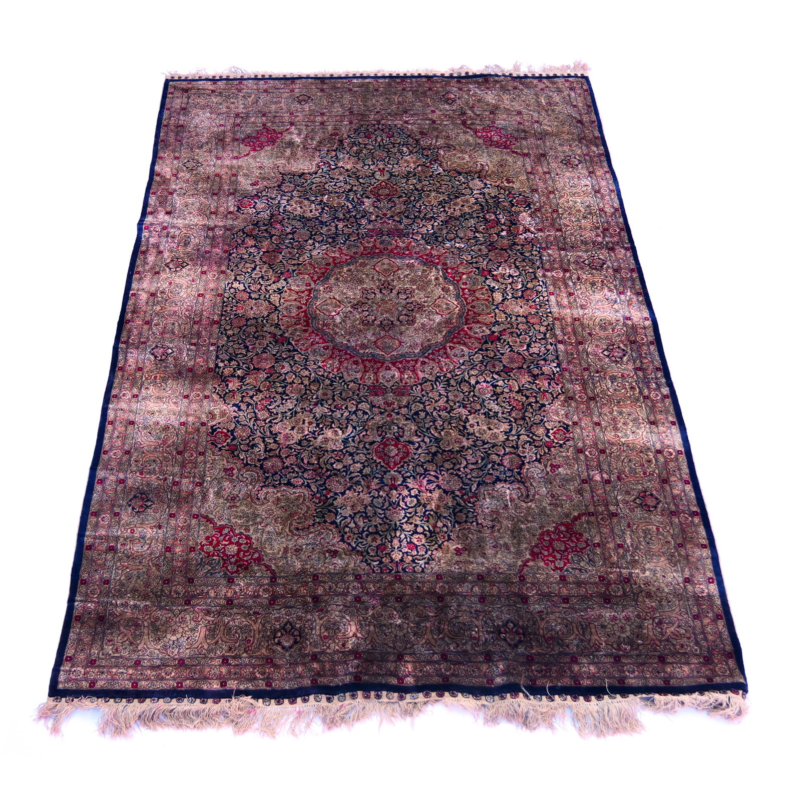 PERSIAN SILK RUG: Late 20th century, medallion within an indigo field with light blue spandrels and light blue borders h. 8 ft. 2 in. w. 5 ft. 2 in. Provenance: From the collection of a prominent Armonk, NY doctor [In 