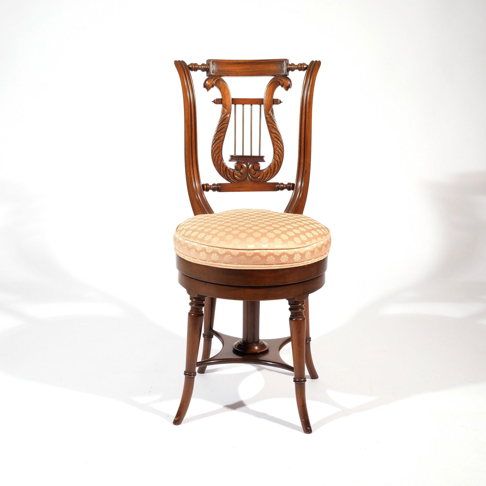 CLASSICAL MAHOGANY LYRE-BACK HARPIST PIANO CHAIR: School of Duncan Phyfe, New York, second quarter 19th century, with swivel seat h. 35 w. 16 d. 17 in. Provenance: Descended through a Greenwich, CT family