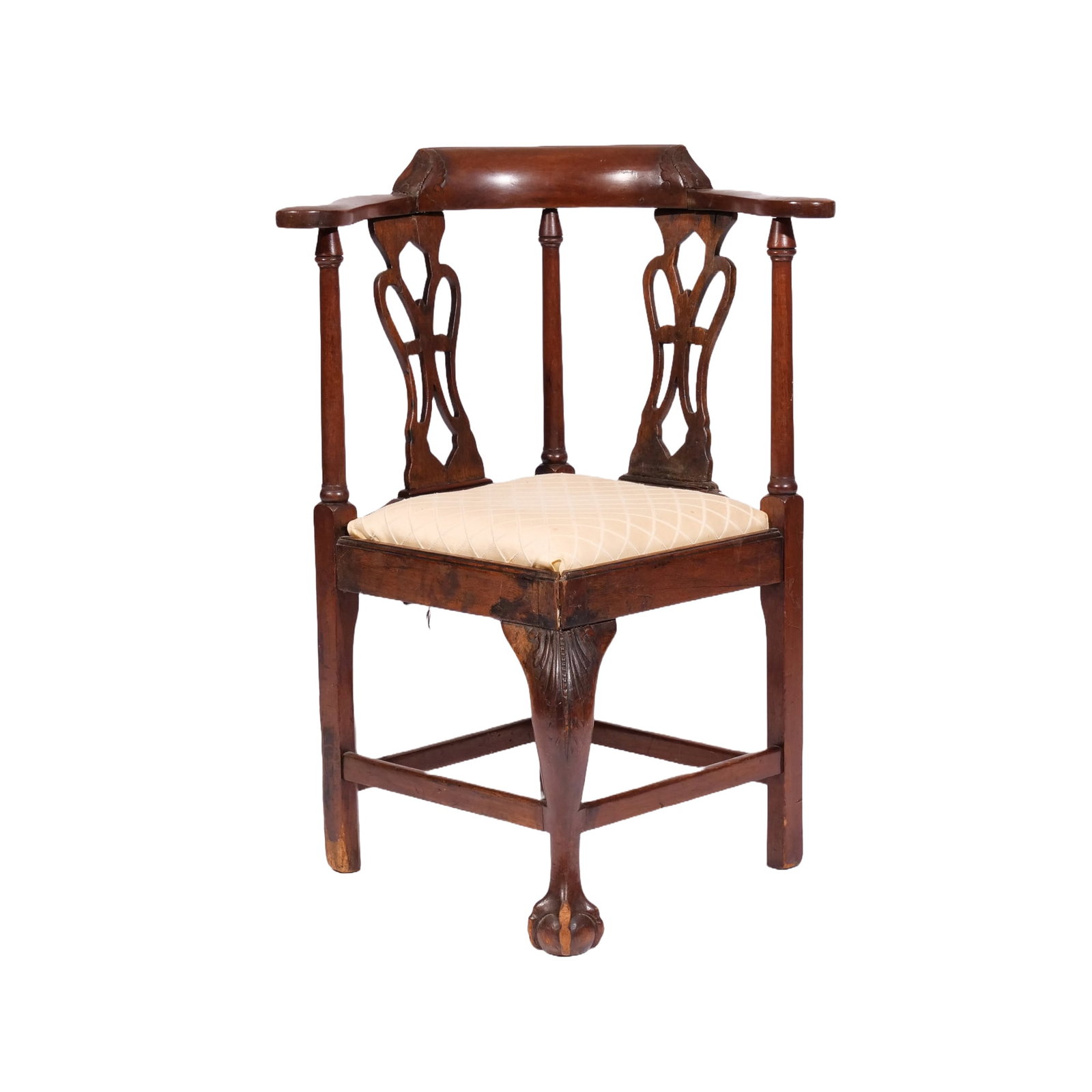 GEORGE III CARVED MAHOGANY CHILD’S CORNER ARMCHAIR: Late 18th century, with foliate carved crest and knee, on a central claw-and-ball foot h. 27 w. 18 d. 18 in. overall: Seat height 14 inches Provenance: Aline Thorold (1869-1951) m. Ernest James Wythes