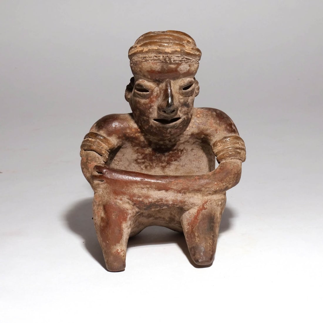 PRE-COLUMBIAN SEATED POTTERY FIGURE (1 of 11)