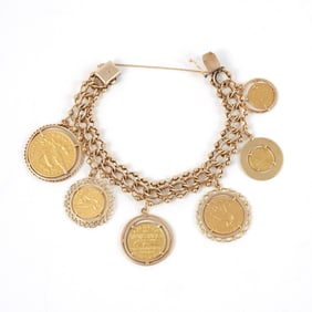 14K GOLD CURB LINK BRACELET with SIX GOLD COINS