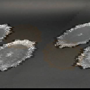 PAIR of GEORGE III OLD SHEFFIELD PLATE SALVERS: Late 18th century, pair of Sheffield silverplate salvers or waiters, with scalloped edges and paw feet, each engraved with armorial device dia. 13-1/4 in. Provenance: James Robinson Inc., New York (la