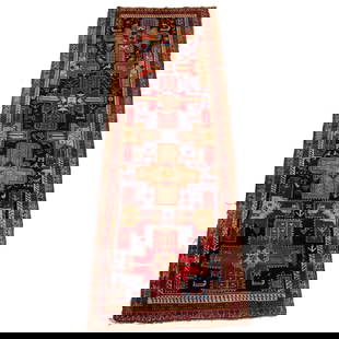 ANTIQUE CAUCASIAN RUG: Having a row of four geometric medallions, the field with scattered animals h. 10 ft. 6 in. w. 3 ft. 5 in. Provenance: Collection of Eastchester, N.Y. gentlewoman
