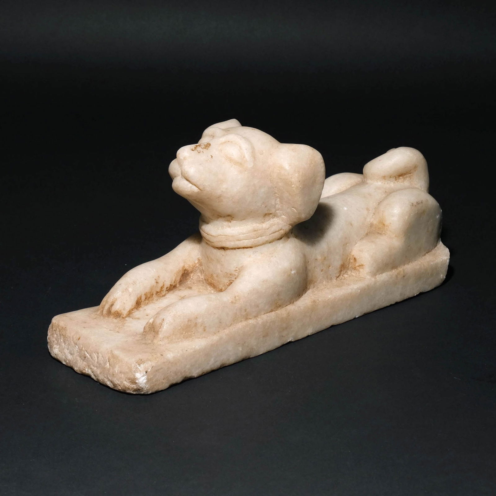 CARVED ALABASTER FIGURE OF A DOG: No apparent signature, appx. 20 pounds h. 6 w. 13 d. 4 in. Provenance: Descent through the family of an avid collector and dentist, Armonk, NY [IN SITU ITEM] This item will not be on display in our sa
