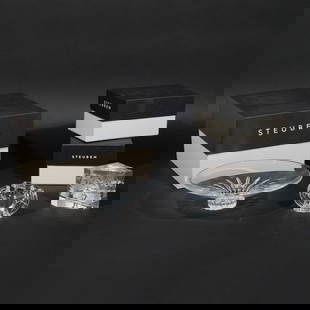 (3pc) BOXED STEUBEN CRYSTAL PIECES: Including an eagle, w. 4-1/2 , H. 3 in; an etched block with a skier, h. 3-12 in., w. 4-1/4 in.; and a low form footed bowl, dia. 10 in., h. 2-3/4 in.; all with original bags and boxes Provenance: The