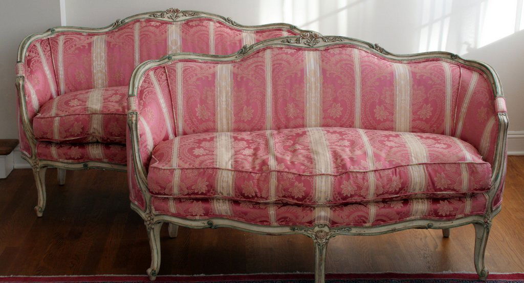 16) PAIR OF LOUIS XV-STYLE CARVED SETTEES with: polychrome highlights, by John Widdicomb, Grand Rapids, with down cushions. H: 33" W: 56" D: 30"