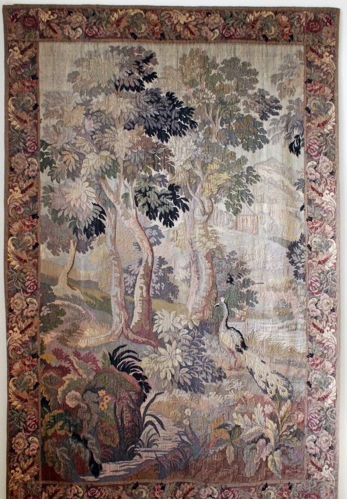 29) 19TH C. FRENCH AUBUSSON VERDURE HAND WOVEN WOOL: TAPESTRY, depicting a peacock in a landscape setting with castle, c. 1875, 119" x 77", prov.: purchased by the consignor from S. A. Metrax, 1991, w/ letter stating that the tapestry was woven by hand 