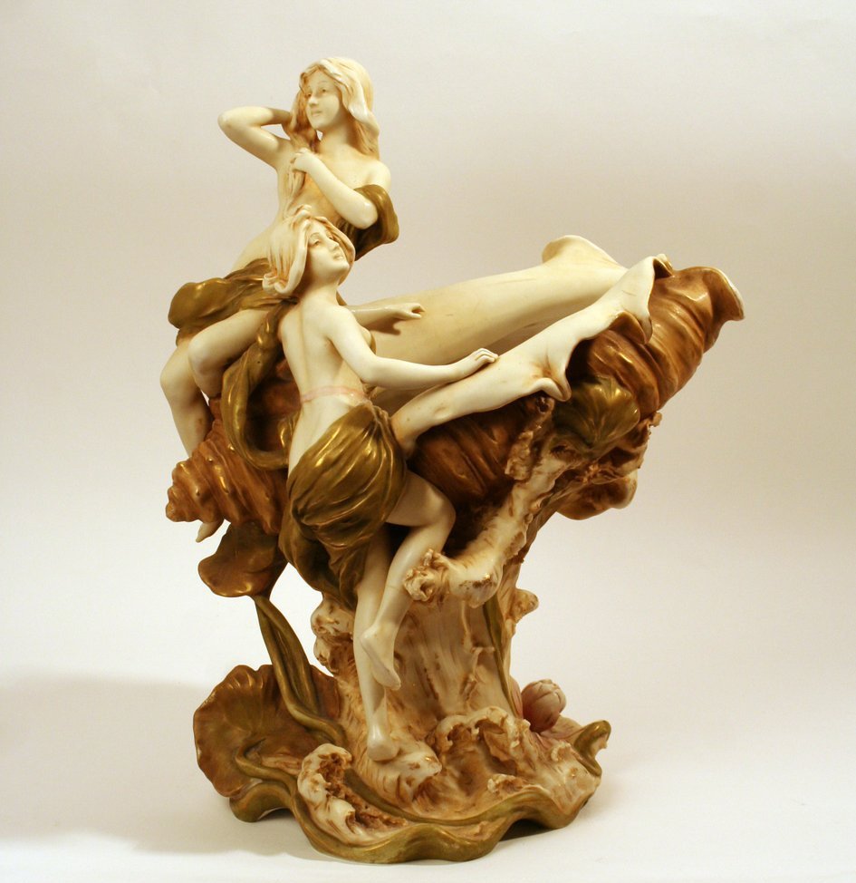 92) ROYAL DUX GROUP showing two nymphs bathing: by a large conch shell, H: 16 ½" W: 13 ½" D: 9"