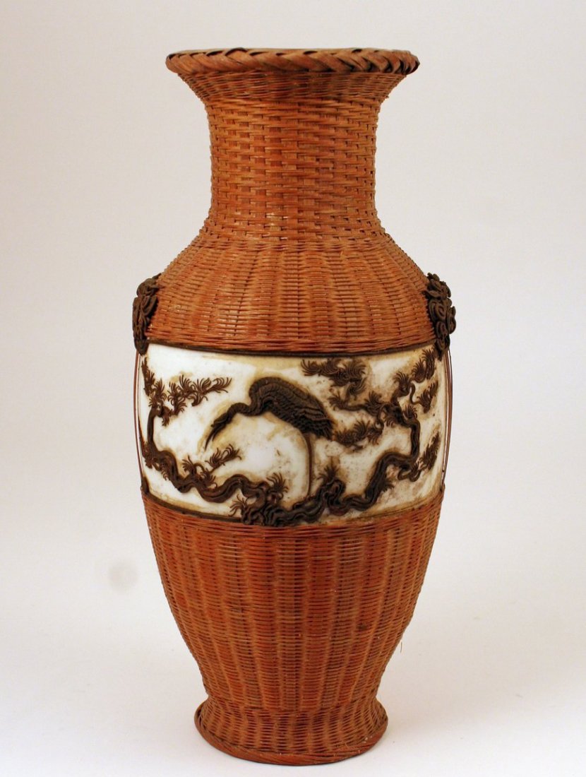 546) 19TH C. CHINESE PORCELAIN VASE with rattan: 546) 19TH C. CHINESE PORCELAIN VASE with rattan basketry and metal overlay of bird within leafy vine motif w/dragon heads, H: 13 1/4", cond.: missing pc. Of metal overlay along border edge