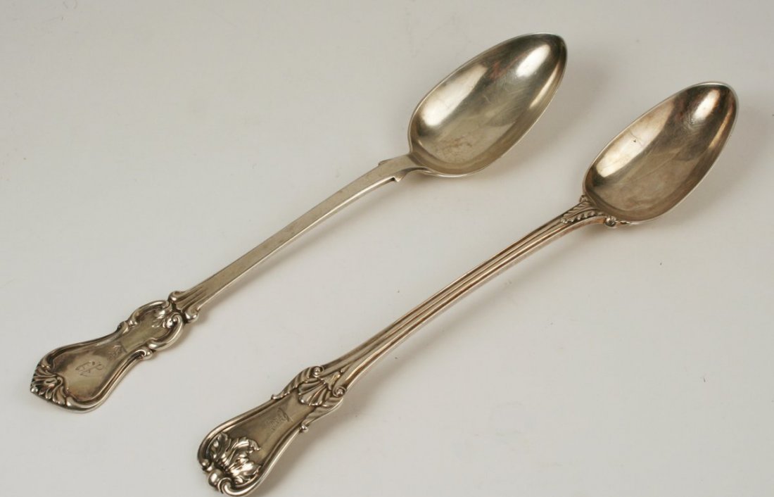 664) 2 ANTIQUE ENGLISH SILVER STUFFING SPOONS,: one Georgian spoon with acanthus leaves, circa 1785 (L: 12 1/4"), the other circa 1841 (L: 12"). Total approx. weight: 13 TOZ