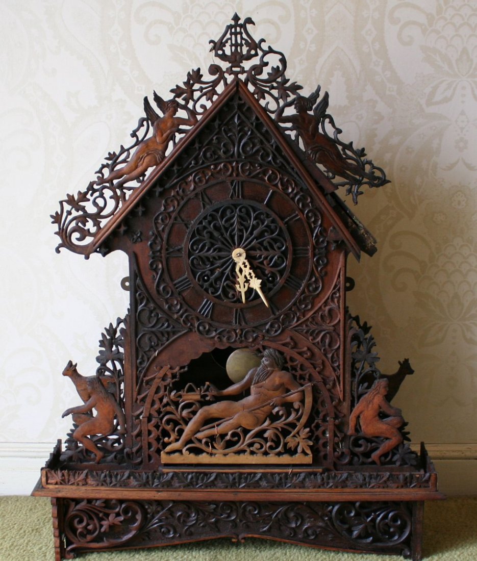693) SWISS BLACK FOREST FRETWORK SHELF CLOCK: with Father Time and other mythological figures. H: 27" W: 20" D: 5"