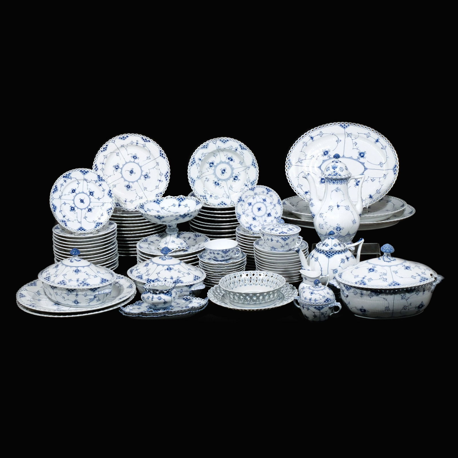 (140pc) ROYAL COPENHAGEN BLUE LACE CHINA SERVICE: Mid 20th century porcelain, each marked Royal Copenhagen Denmark and variously numbered, mostly 'Blue Fluted Full Lace' pattern; including 14 dinner plates (10 in., 5 damaged), 6 luncheon plates (9 in