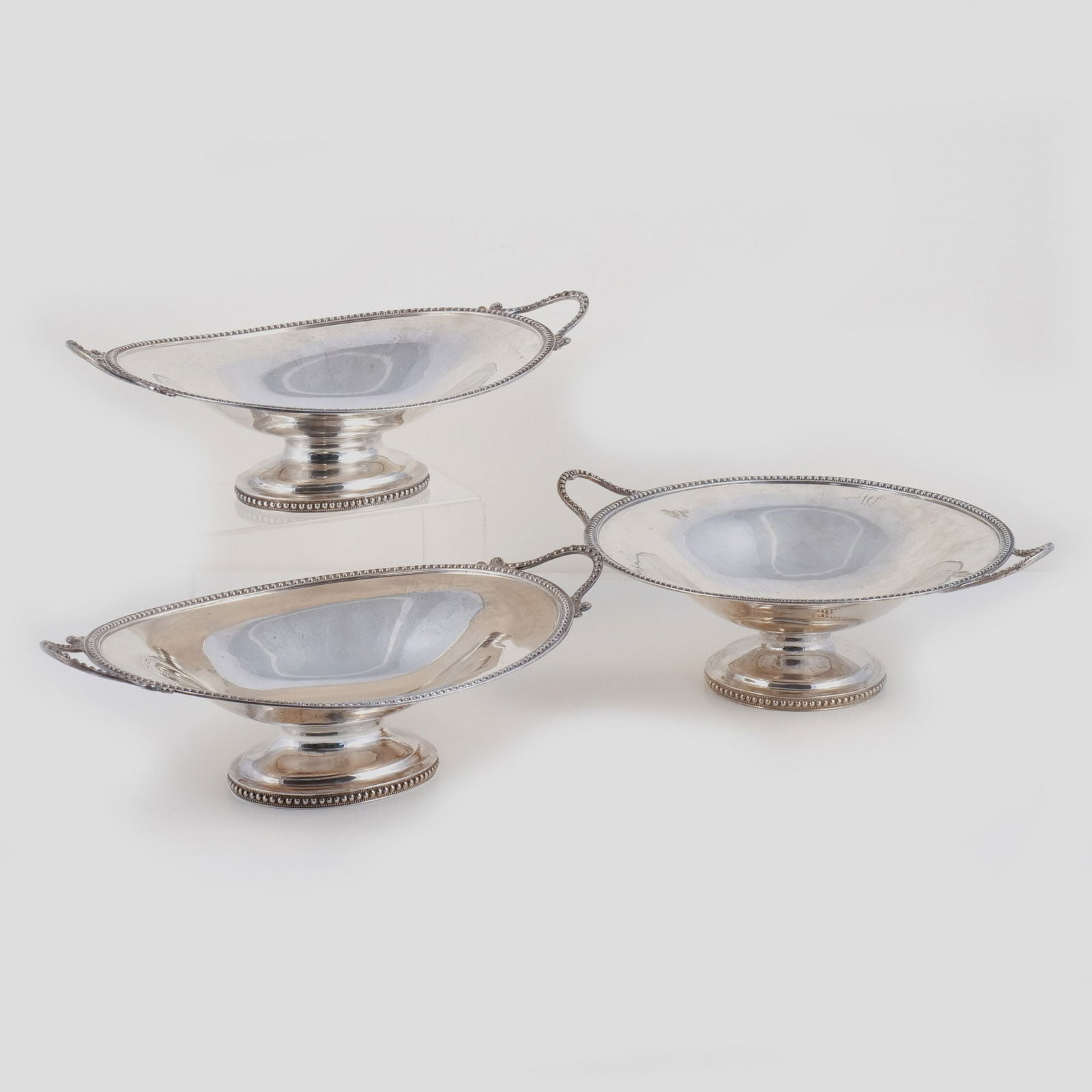 (3pc) W. ADAMS NEW YORK COIN SILVER GARNITURE: Circa 1840-51, William Adams (New York, d. 1861), comprising a center bowl and two side bowls, each with double handles and beaded trim, stamped 'W. ADAMS' and 'NEW YORK', monogramed 'L(?)A', 60.6 ozt