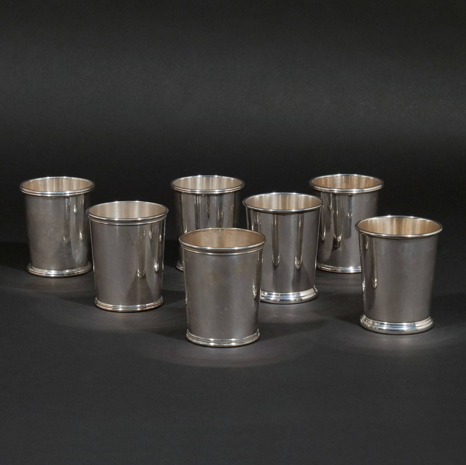 (7pc) STERLING SILVER MINT JULEP CUPS: Including a pair by the Frank Herschede Co.; a pair marked 'JFK' and 'Mark J. Scearce / Shelbyville / Kentucky'; and three by B&M; 30 ozt h. 3-3/4 in. Provenance: A prominent New Canaan, CT estate