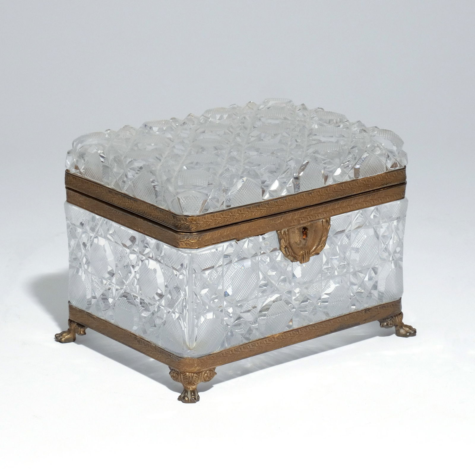 FRENCH CUT-GLASS CASKET: Early 20th century, with ormolu mounts, no apparent signature h. 5-3/8 w. 7-1/2 d. 5-1/2 in. (overall) Provenance: A nonagenarian collector, Riverdale, NY [In Situ Item] This item will not be on displ