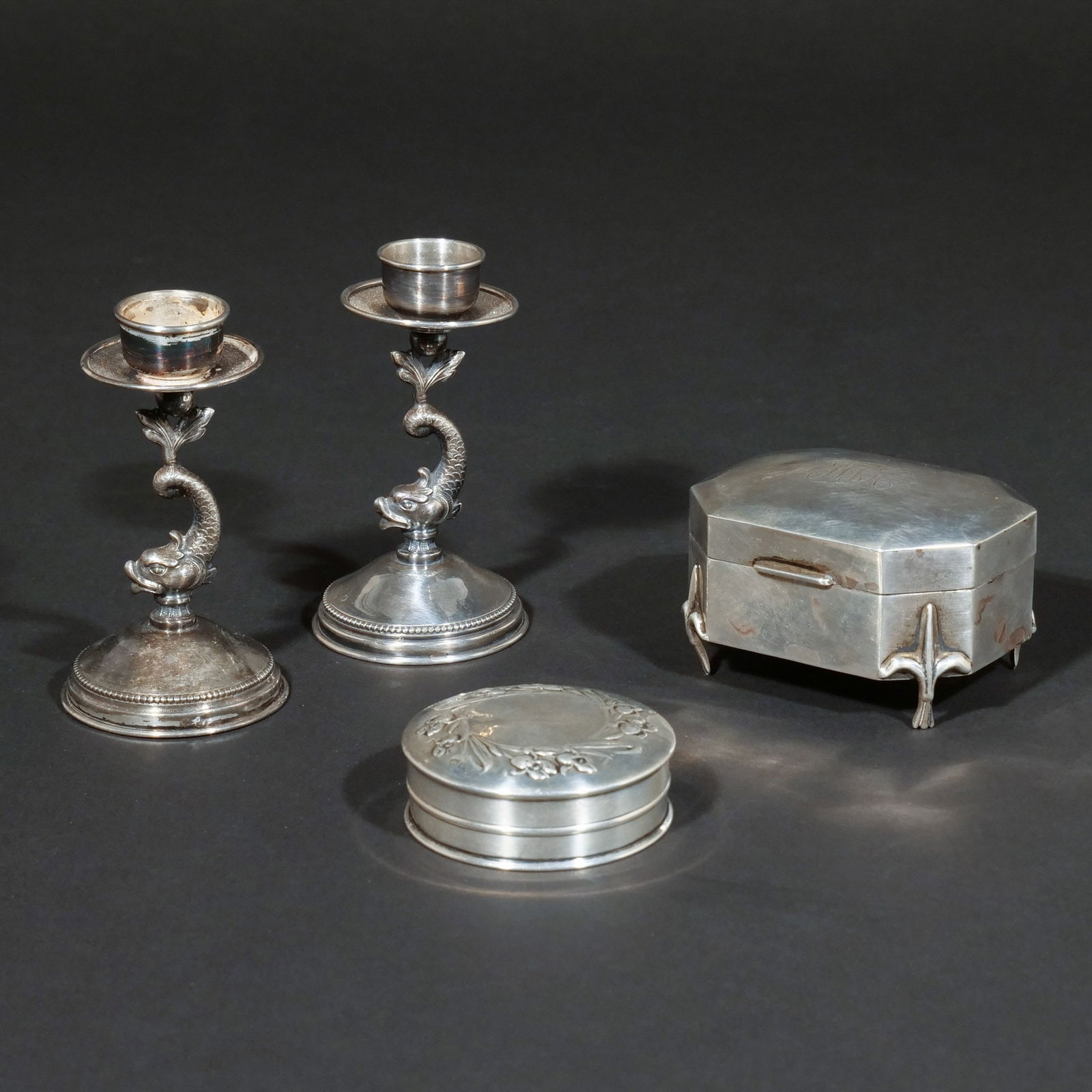 (4pc) ANTIQUE SILVER CANDLESTICKS & BOXES: Including a pair of Spanish silver taper candlesticks having chased Dolphin posts, pentagram mark and urn-shaped maker's mark; a Birmingham silver octagonal hinged trinket box with fleur- de- lis feet