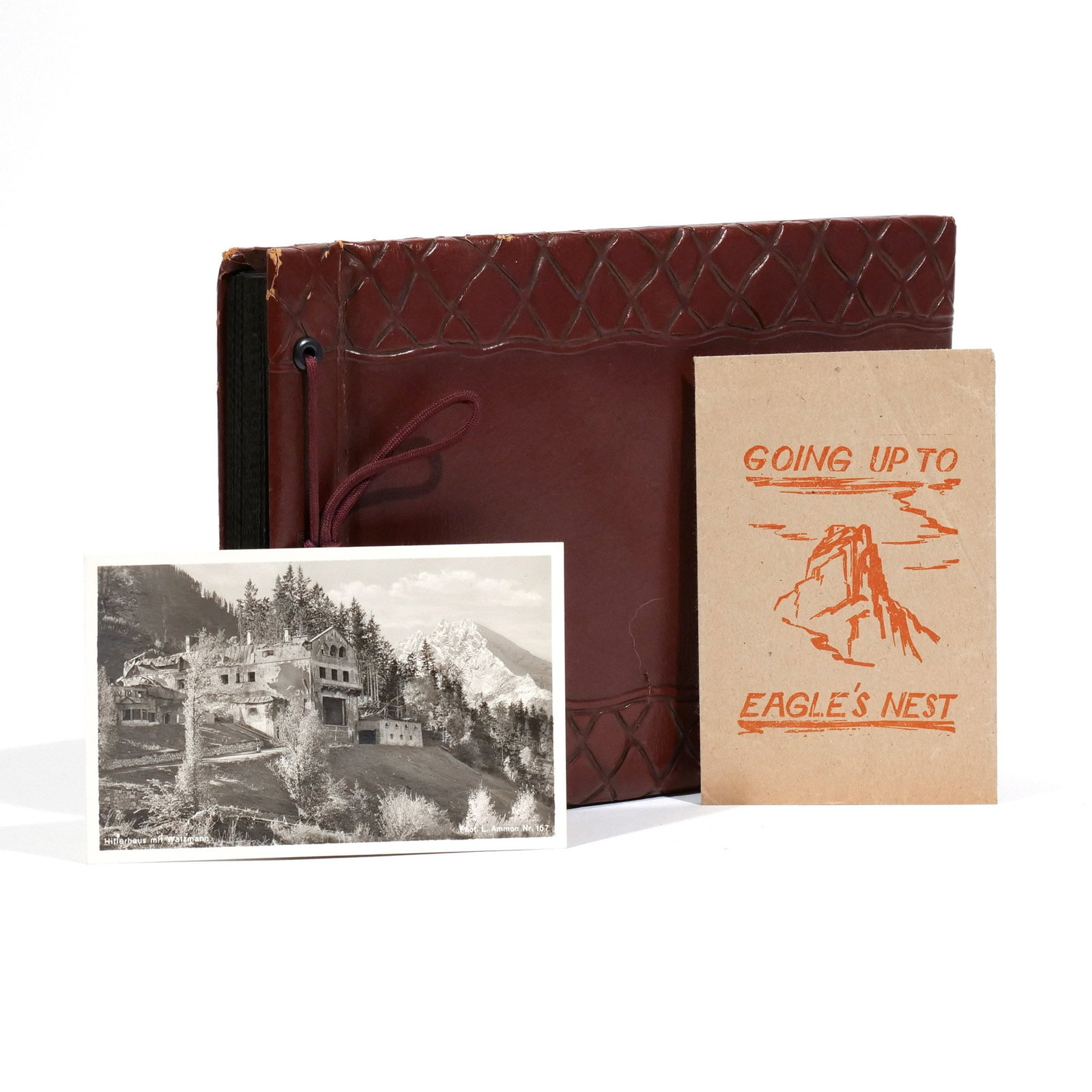ALBUM OF PHOTOS FROM EAGLE'S NEST (BERGHOF): Containing 38 period photographs of Hitler's home (Berghof) before and after the war, annotated by a former owner and mounted in an album, 20 of the photos coming from a small packet called "Going Up 