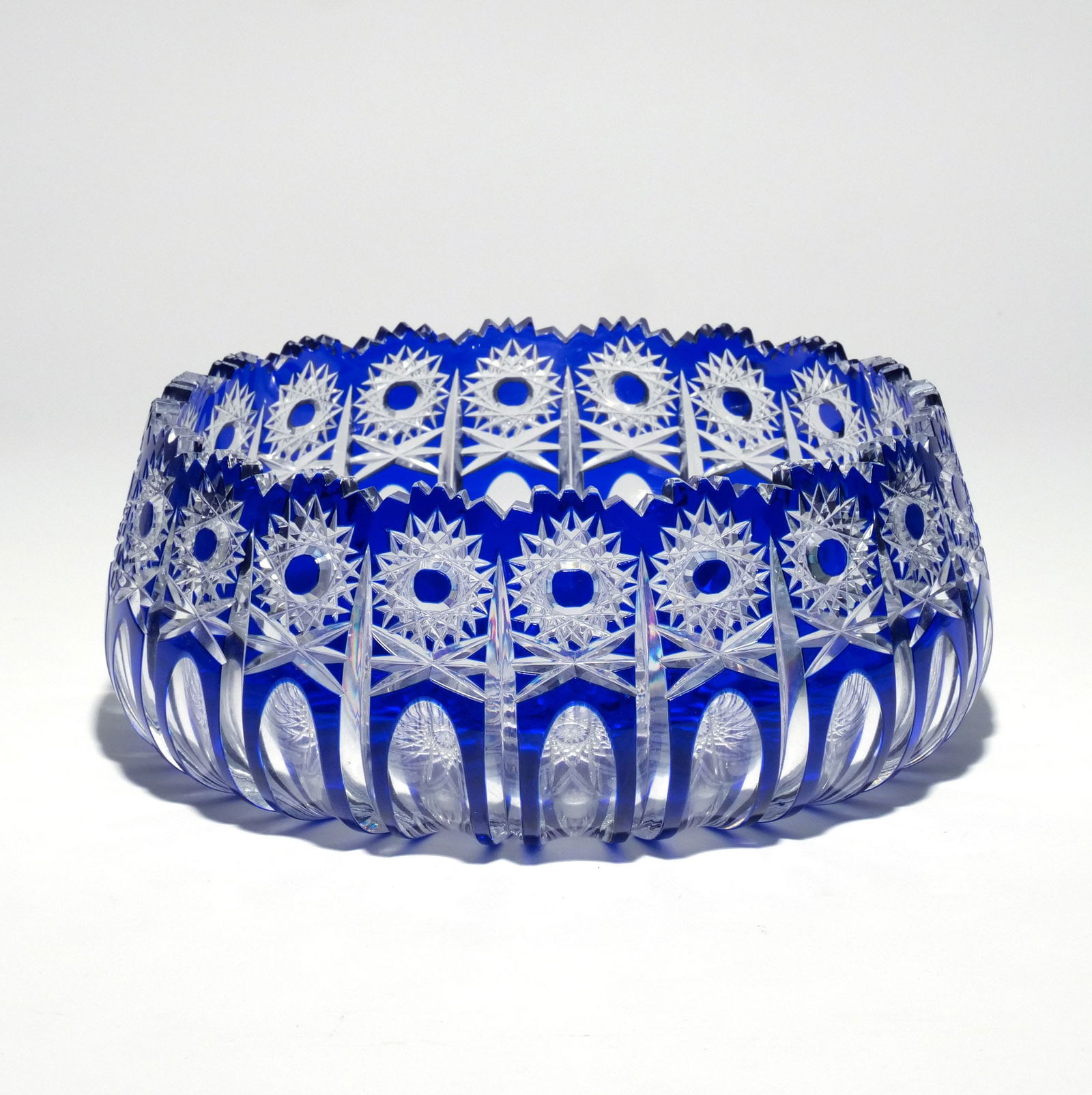 BOHEMIAN CUT CRYSTAL CENTRE BOWL: Cobalt cut-to-clear glass h. 4-1/4 dia. 10 in. Provenance: Descended through the family to the current owner, Scarsdale, NY [In Situ Item] This item will not be on display in our saleroom during our p