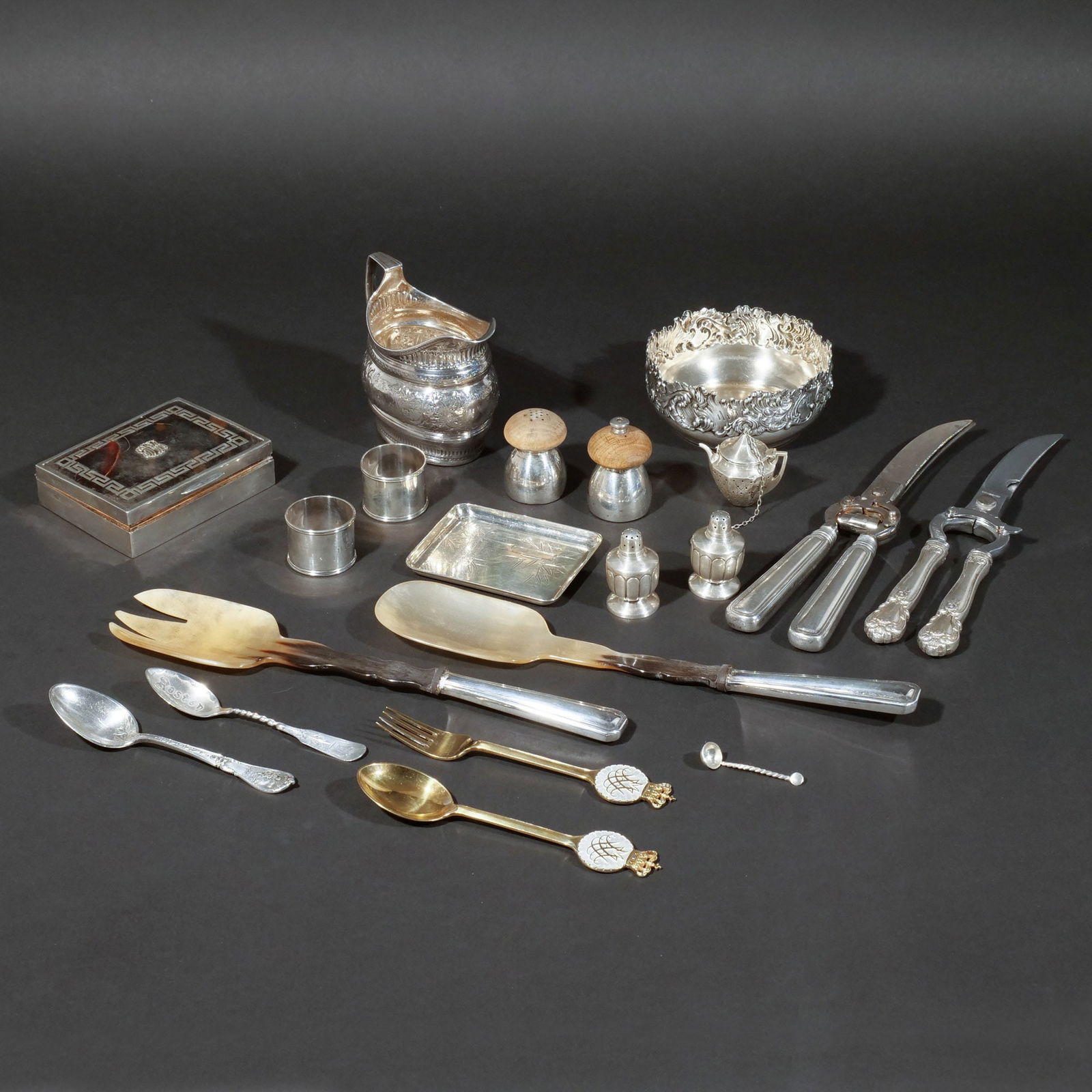(19pc) MISC. STERLING HOLLOWARE & FLATWARE: Sterling items including a Georgian creamer en repousse, an English cigarette box with celluloid lid, a wine coaster with repousse rim, 2 napkin rings, an ashtray, a pair of diminutive shakers, a tea