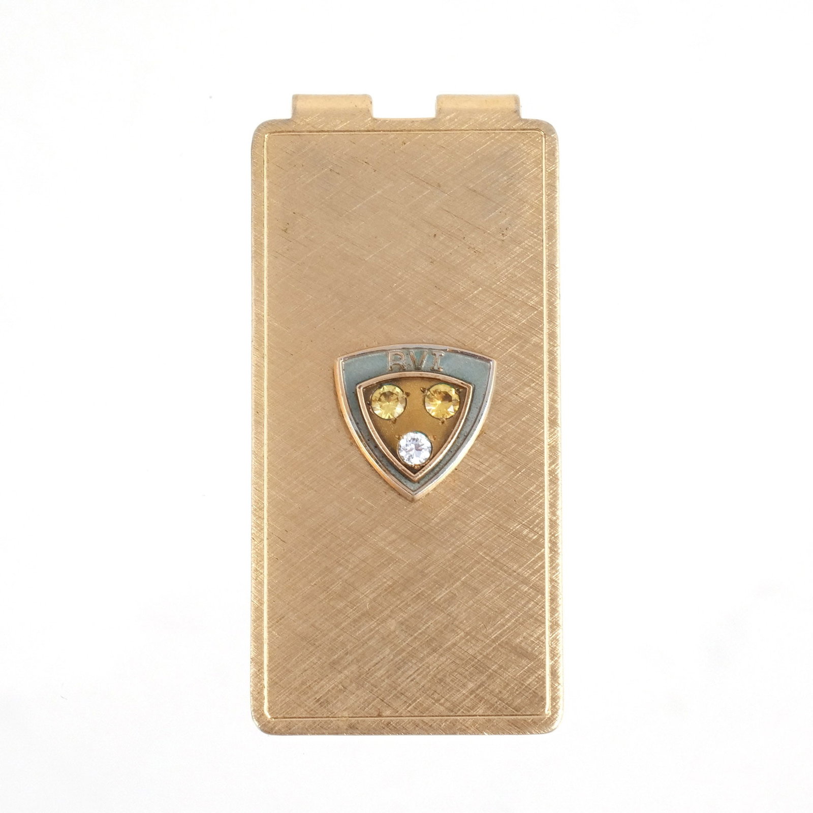 10K GOLD AND DIAMOND MONEY CLIP: Mounted shield within shield emblem with the initials 'RVI' and 3 melee diamonds, two intense yellow and one white, stamped 'Anson', no fineness mark but tests to 10k, 16.5 grams total weight 