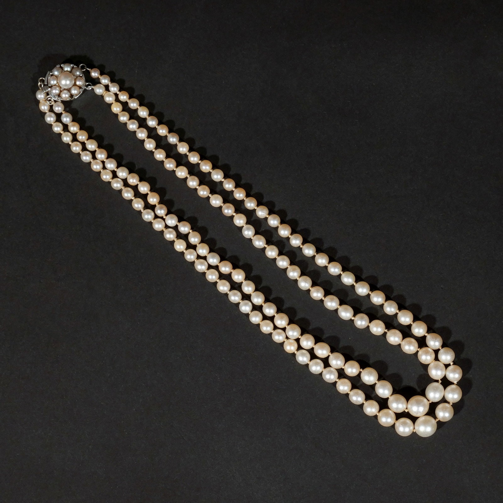 ANTIQUE DOUBLE STRAND PEARL NECKLACE: With a 14k white gold clasp (unmarked but tests as 14k) Provenance: Descent through a prominent Manhattanite's estate