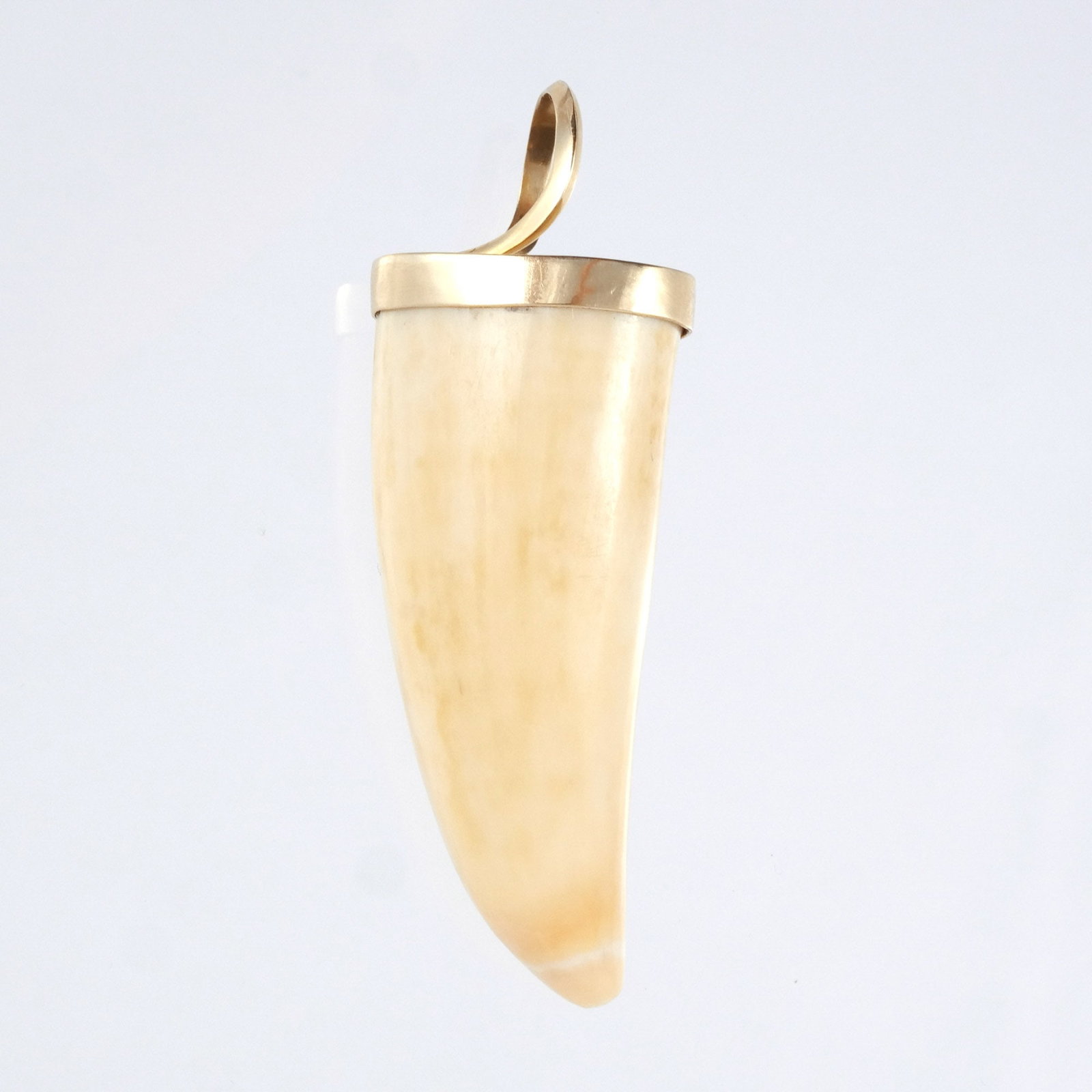 PENDANT WITH 18K GOLD CAP: With curved bale, marked '750' and with possible maker's mark, 9.4 g weighable gold h. 3-3/4 w. 1-1/4 in. Provenance: Descent through a prominent Manhattanite's estate [In Situ Item] This item will
