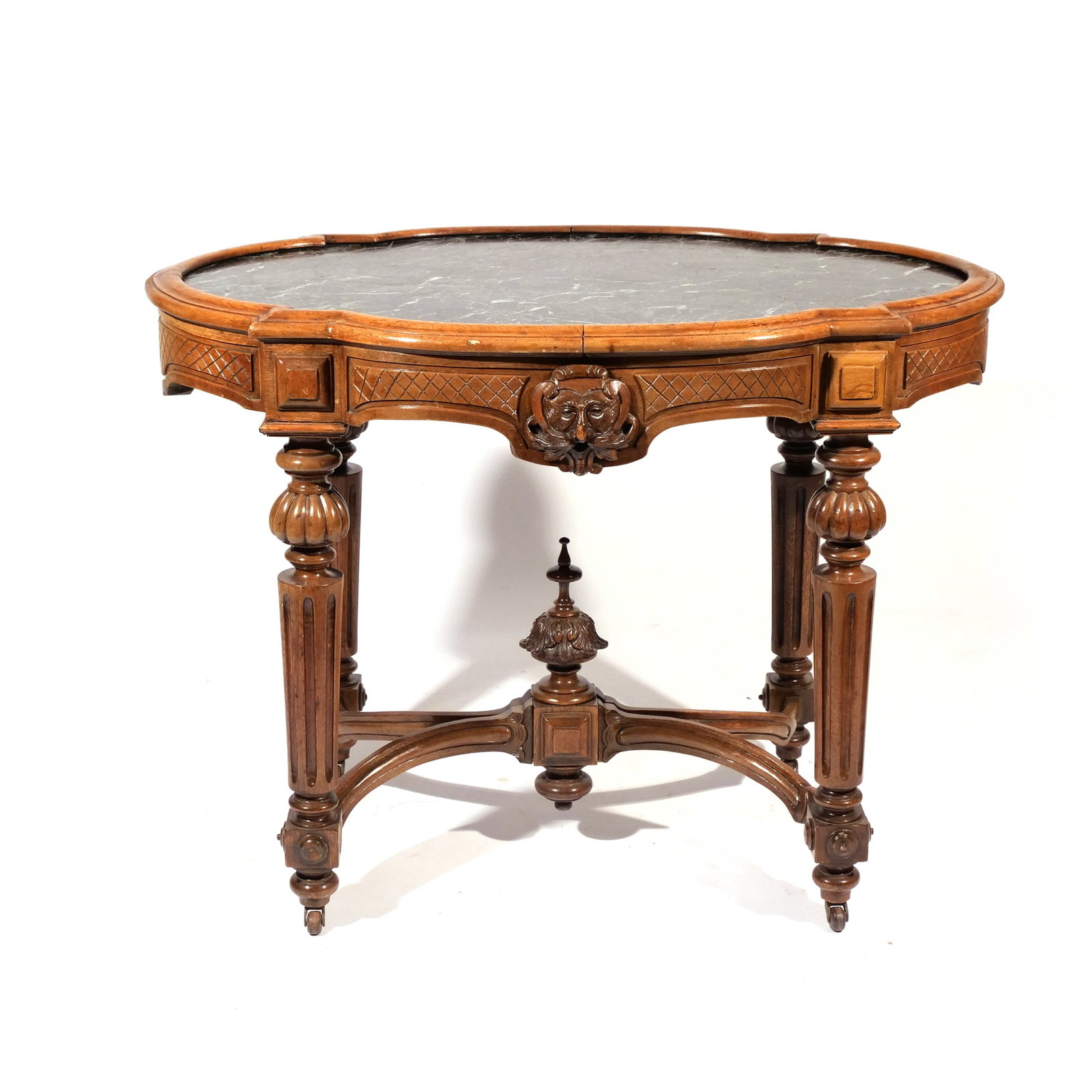 AESTHETIC PERIOD WALNUT MARBLE CENTER: Late 19th century, with original Verde Antico marble top, mounted on casters h. 30 w. 40 d. 27 in. Provenance: By descent through a Bedford, NY family [In Situ Item] This item will not be on display i