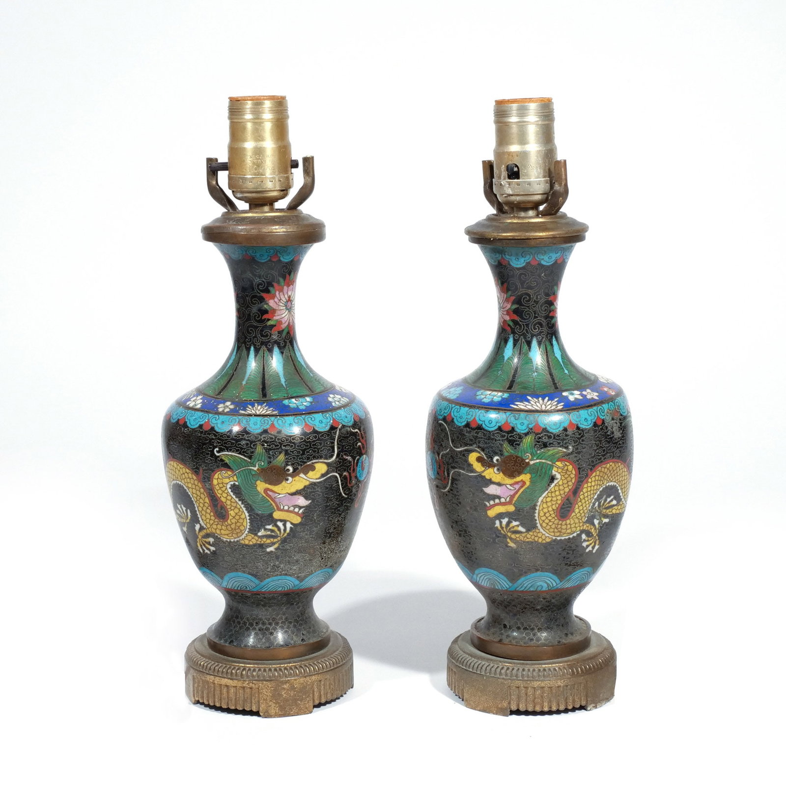 PAIR of CHINESE CLOISONNE VASES: Late 19th / early 20th century, each with yellow dragons chasing a pearl on a black ground, mounted as lamps h. 9 in. (vase) overall: h. 13 in. (over socket) Provenance: Consigned by downsizing nonage