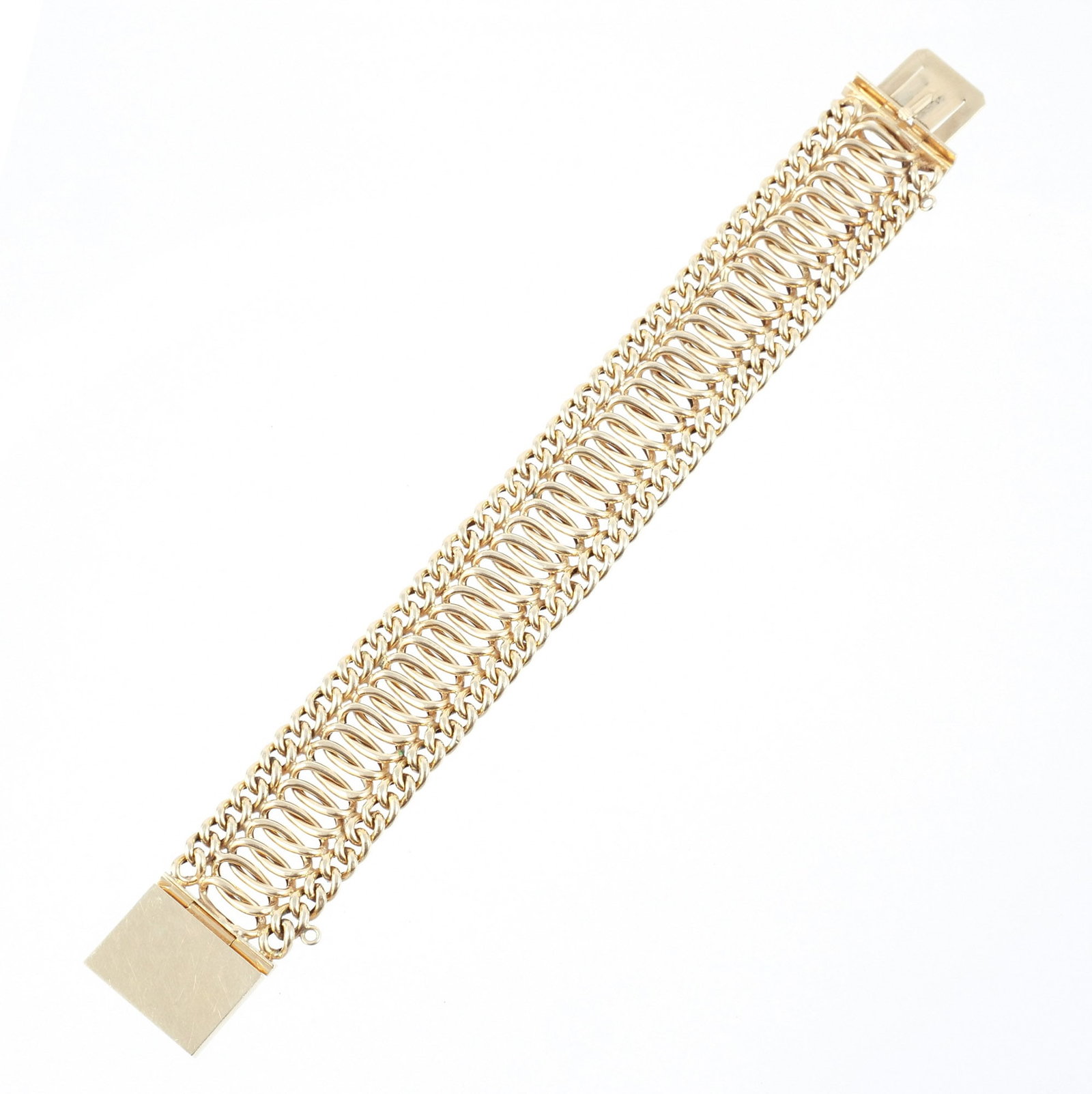 14K GOLD WOVEN LINK BRACELET: Composed of flexible round and curb chain links, marked 14k, l. 7-1/2 in., 28.3 g w. 7/8 in. Provenance: The estate of a noted architect and bibliophile, Rye, NY
