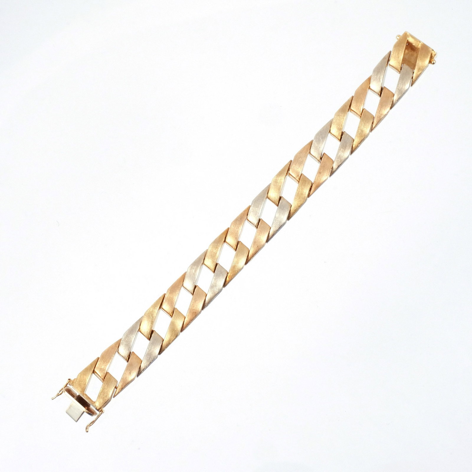 18K TRI-COLOR ITALIAN GOLD BRACELET: Composed of interlocking brushed yellow, white, and rose gold diagonal bar links, signed with maker's mark and registration for Dal Corno Ferruccio, marked '750', l. 7-1/2 in., 40.8 g w. 5/8 in. Prove