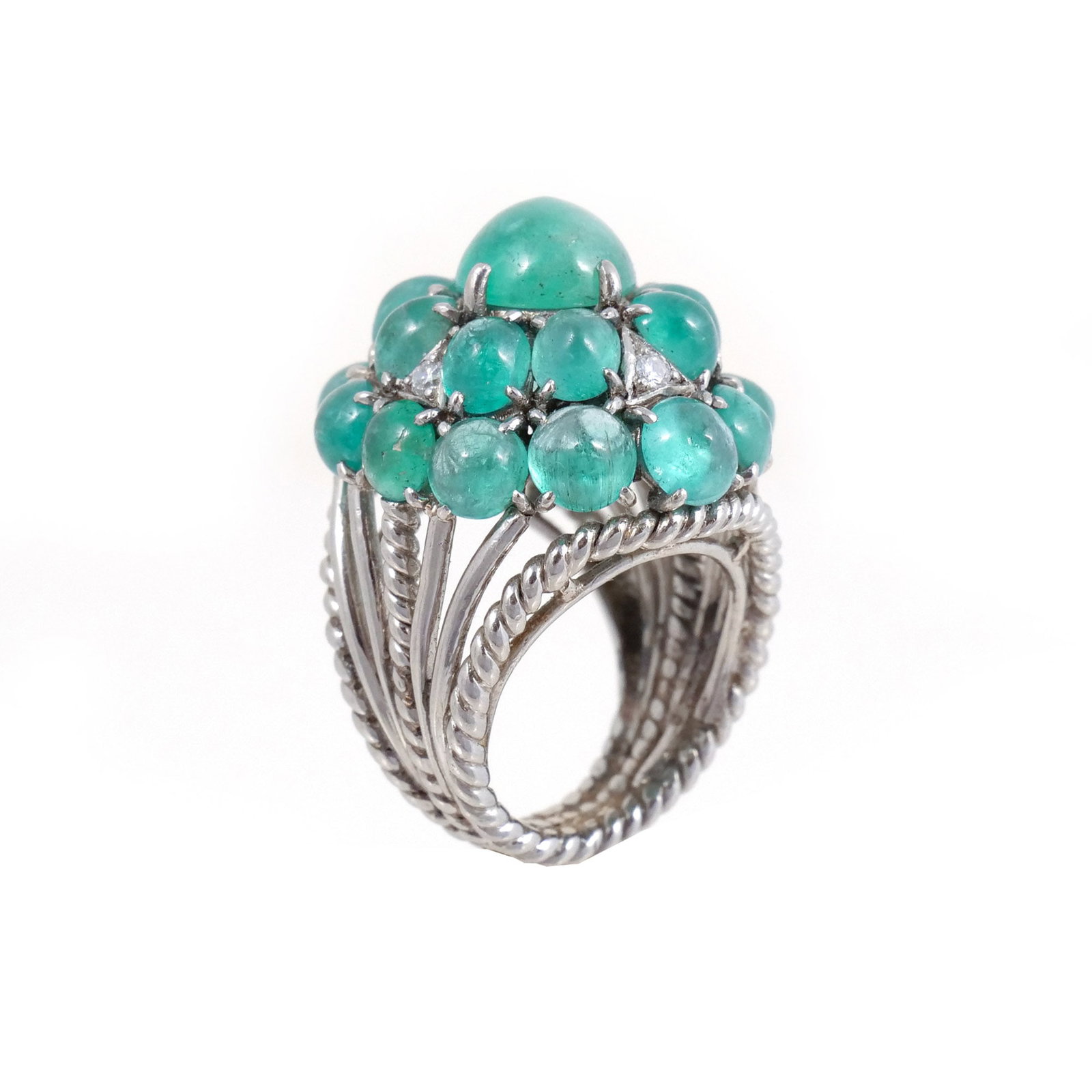 EMERALD CABOCHON CLUSTER RING: Set in 14k white gold, with an approx. 3 ct center emerald cabochon surrounded by 20 smaller emerald cabochons (appx. 12ct total) spread throughout two rows interspersed with 4 melee diamonds, shanks 