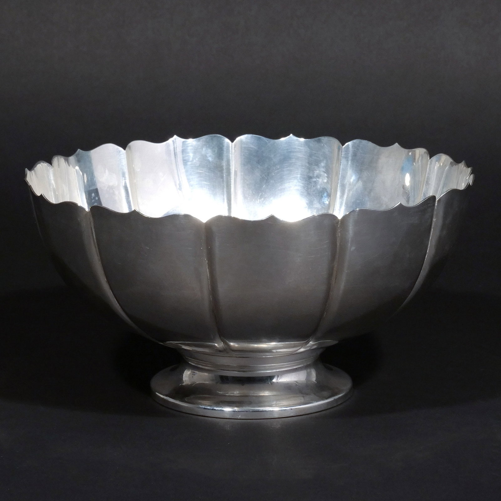 SCALLOPED STERLING SILVER PEDESTAL BOWL: In the 'Dublin' pattern by Fisher Silversmiths, Inc., marked 'Sterling' and with maker's mark, 29 ozt h. 5 in. dia. 10 in. Provenance: The estate of a noted architect and bibliophile, Rye, NY [In