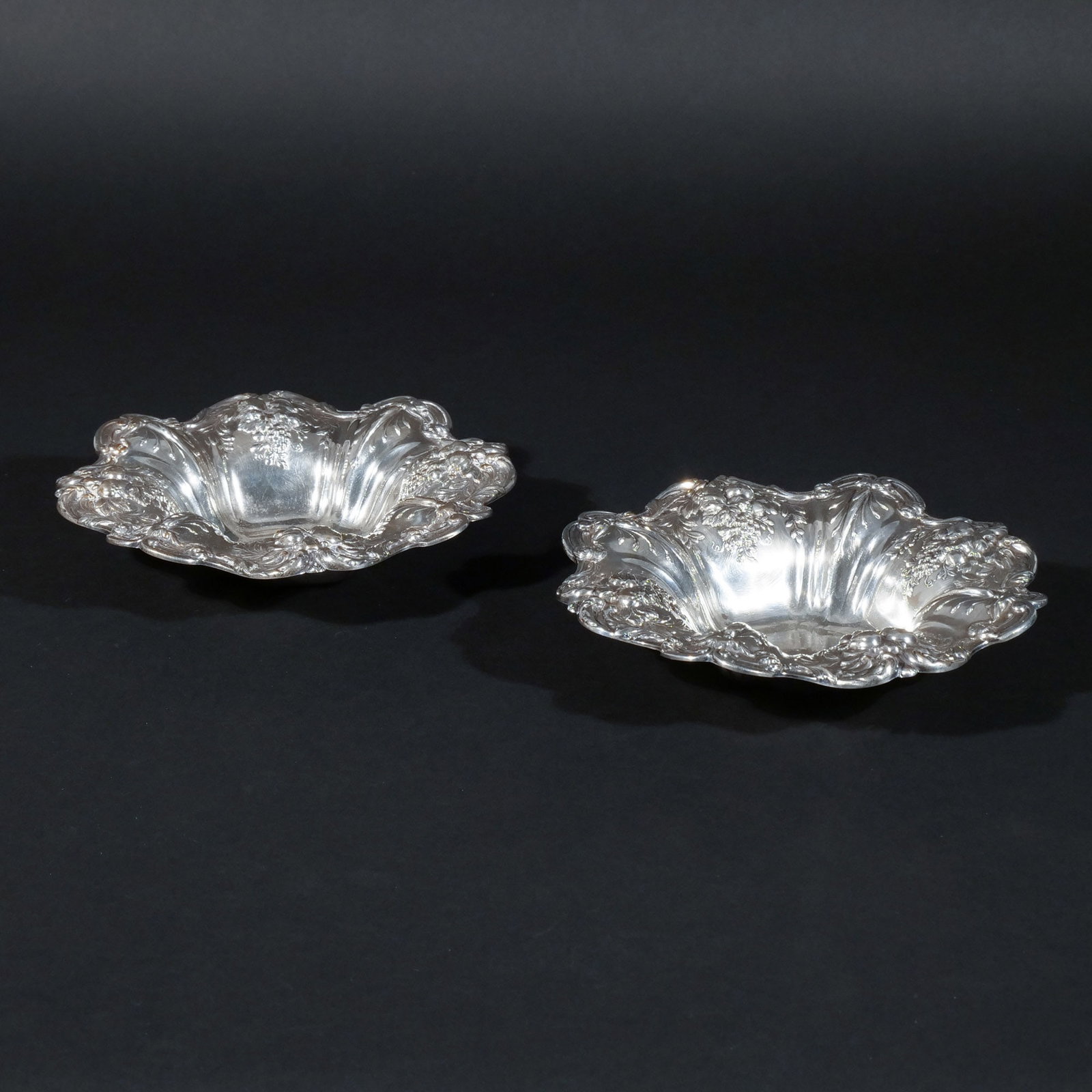 (2pc) PAIR of REED & BARTON STERLING SILVER DISHES: In the 'Francis I' pattern, with maker's mark and stamped 'Sterling', 19 ozt total weight h. 1-3/4 in. dia. 8 in. Provenance: Private collection, Mount Kisco, NY [In Situ Item] This item will not be