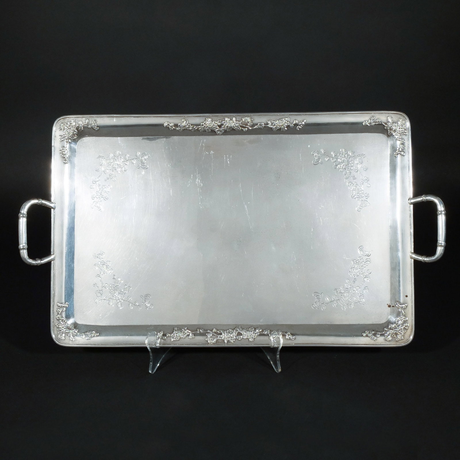 LUEN HING CHINESE EXPORT SILVER TRAY: With engraved and embossed floral motifs, retailed with by Luen Hing & Company, Shanghai, marked LH 90, 80 ozt h. 1-3/4 w. 24-1/2 d. 13-1/2 in. Provenance: Private collection, Mount Kisco, NY