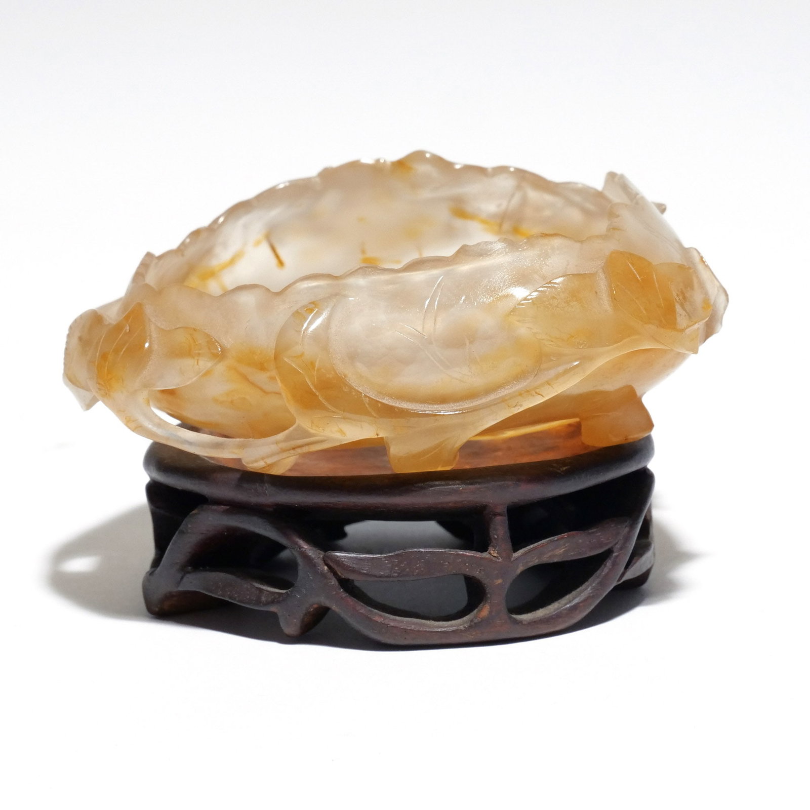 CHINESE RUSSET JADE WATER COUP: Carved with foliate scrollwork h. 1-1/2 w. 3-7/8 d. 3-1/2 in. Provenance: The estate of Richard and Jean M. Bergstresser, owner of the Laurence McGuire House, historic landmark, Greenwich, CT