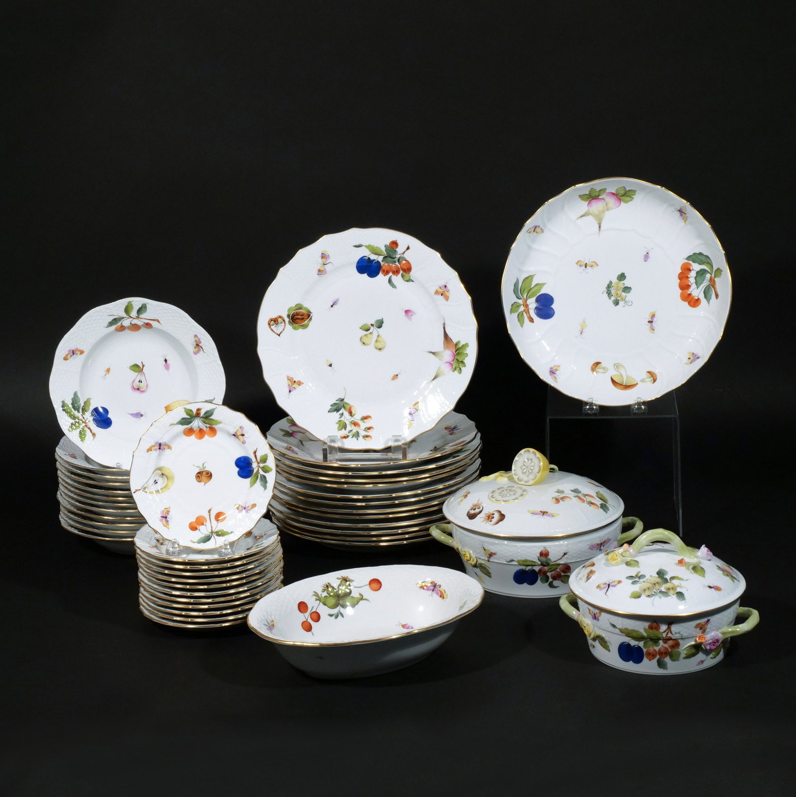 (40pc) HEREND 'MARKET GARDEN' DINNERWARE: Including 12 dinner plates, 12 soup bowls, 12 bread/dessert plates, 2 oval covered tureens, 1 open vegetable bowl, and 1 circular serving tray/dish h. 5 w. 10 d. 8 in. (largest tureen) dia. 10-1/4 in.