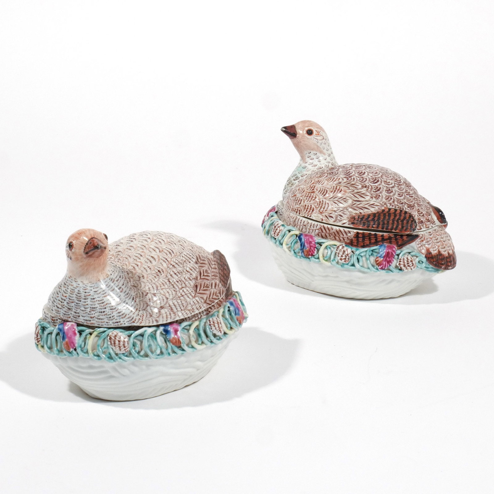 PAIR DR. WALL WORCESTER PORCELAIN TUREENS: Circa 1755-1760, both covered tureens in the form of a pair of partridges (possibly a cock and hen) sitting on a nest with a band of applied rings and foliage, one with a rare workman's mark in black