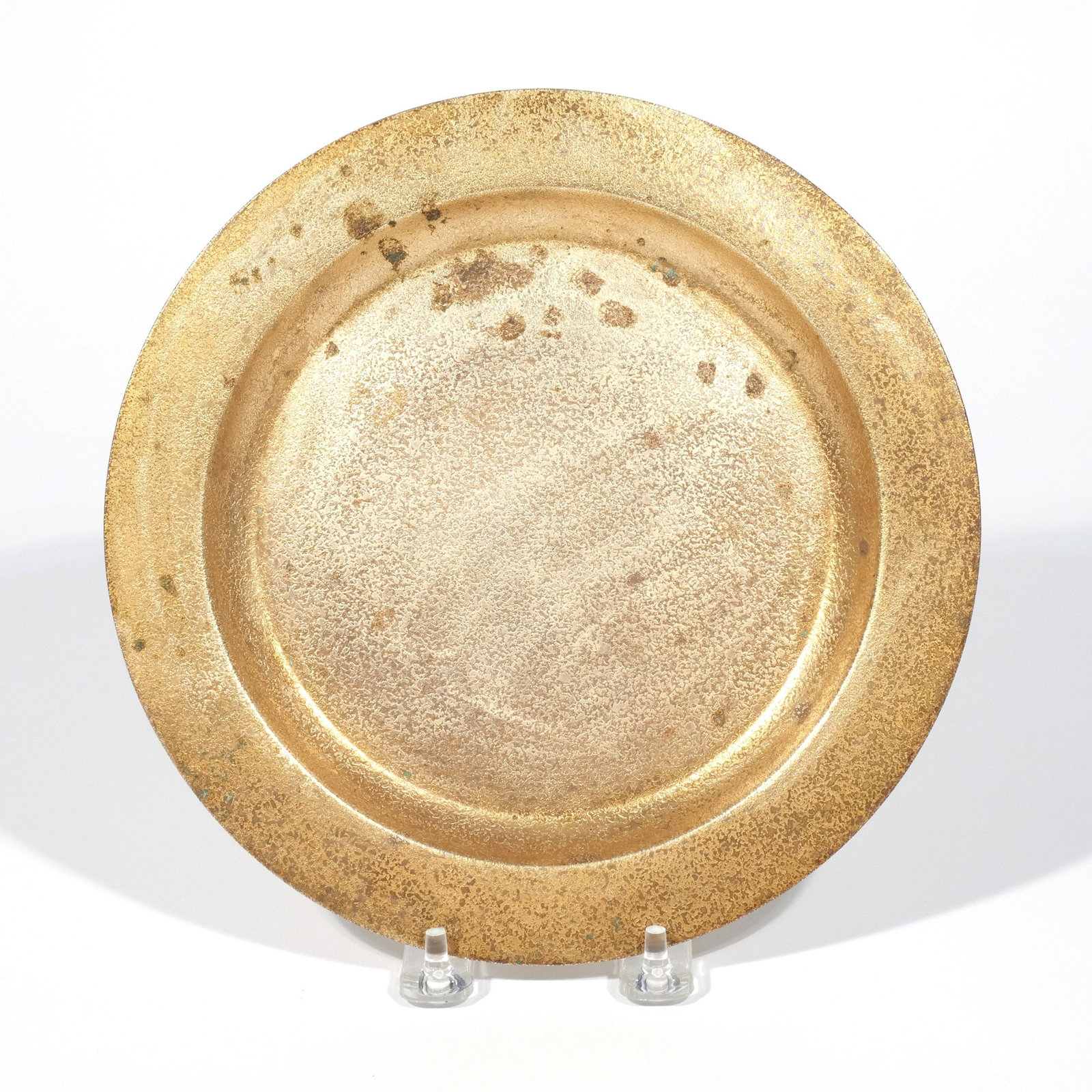 TIFFANY STUDIOS BRONZE DORE PLATE: Marked 'Tiffany Studios / New York / 1736' dia. 9 in. Provenance: The estate of Richard and Jean M. Bergstresser, owner of the Laurence McGuire House, historic landmark, Greenwich, CT [In Situ Item]