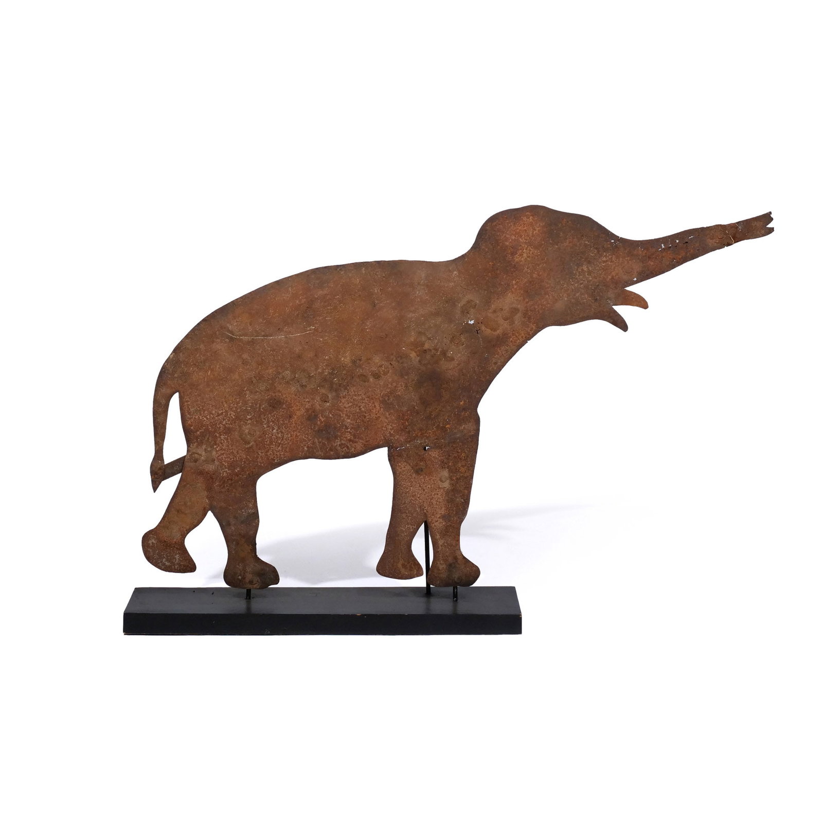 SHEET METAL ELEPHANT WEATHERVANE: c. 1880, with later brace on the obverse, fitted stand h. 27 w. 43 in. overall: 30 x 43 in. (with stand) Provenance: Private collection, Bernardsville, NJ
