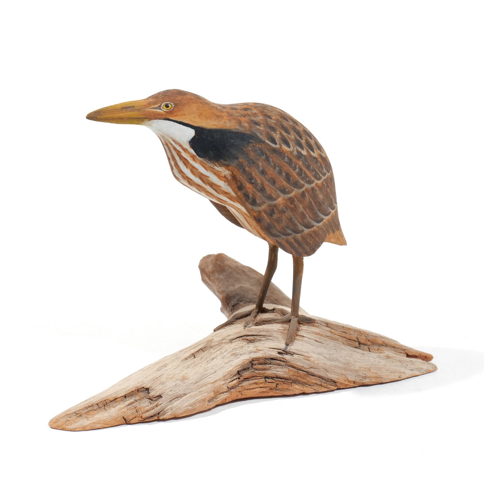 HAROLD GIBBS (1886-1970) BITTERN: Carved miniature, mounted on a driftwood base, signed with conjoined 'HNG', dated 1958, and inscribed 'Bittern' on underside h. 3 w. 4-1/4 d. 2/1/4 in. (overall) Provenance: Descended through the esta