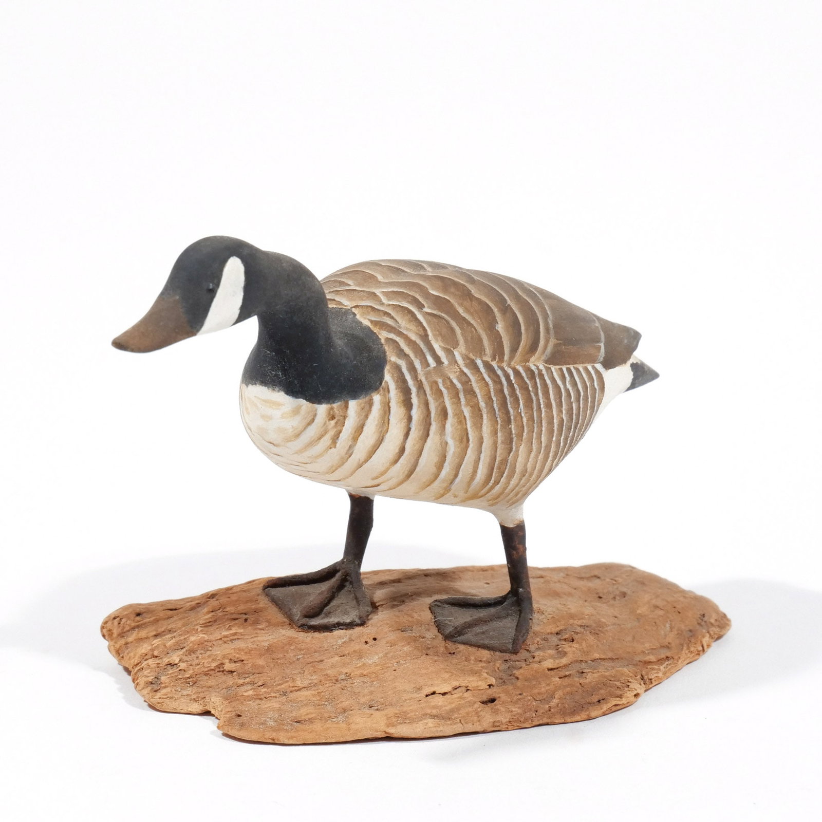 (Attrib.) HAROLD GIBBS (1886-1970) CANADA GOOSE: Carved miniature, on a driftwood base, unsigned h. 2-3/4 w. 5-1/4 d. 2-1/2 in. (overall) Provenance: Descended through the estate of U.S. Ambassador James C. H. Bonbright, Washington, DC